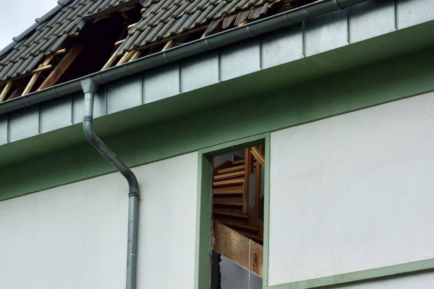 Emergency roof tarping after storm damage