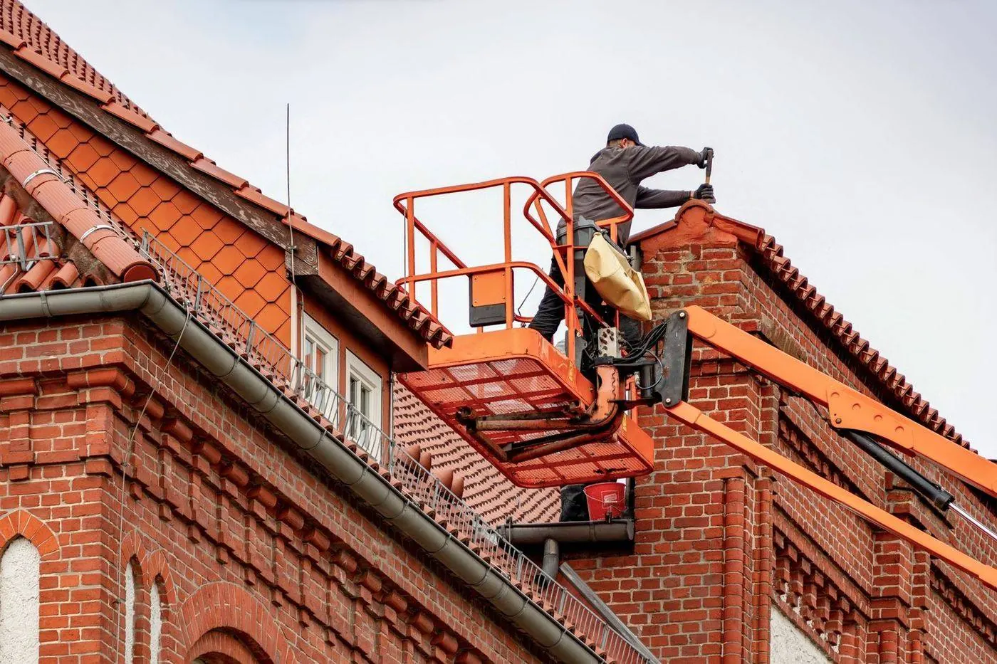 Roofer at work performing a repair on a flat roof