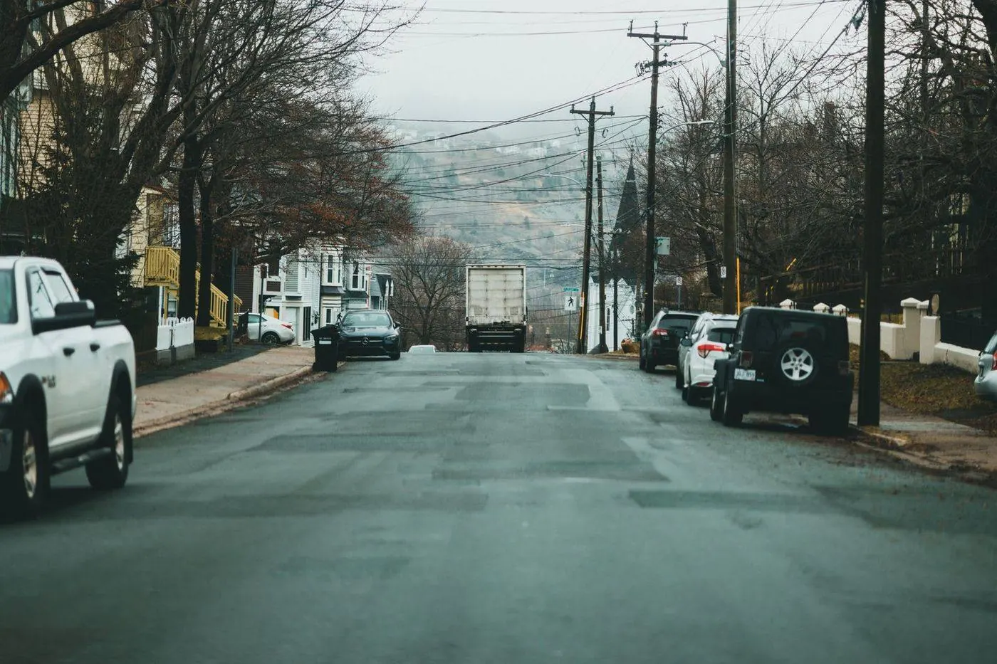 Suburban township street with two-story colonial homes in Old Bridge, New Jersey