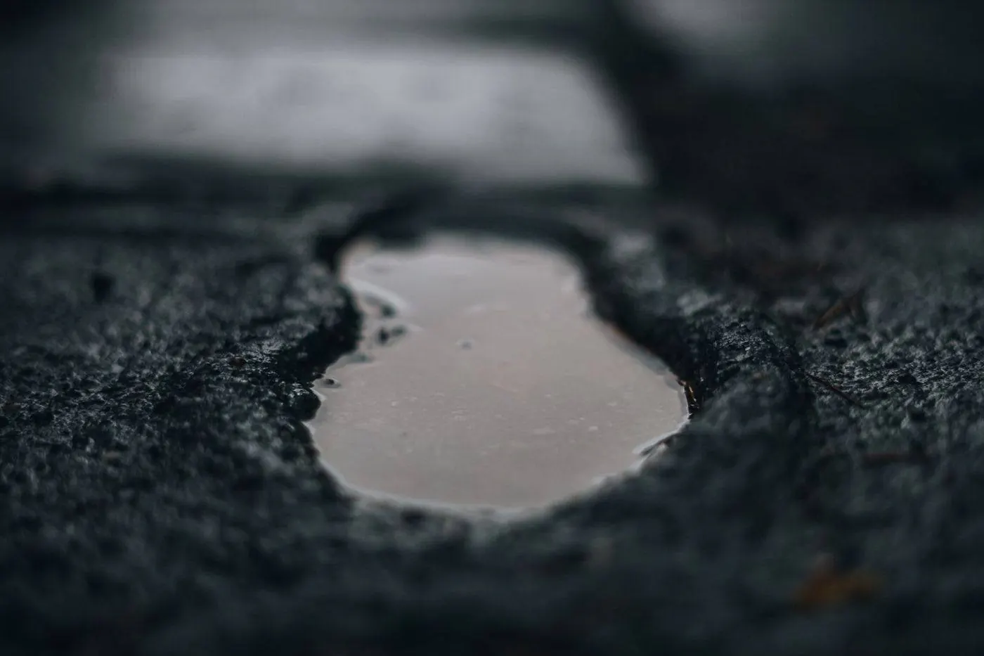 Standing ponding water on a flat membrane roof after rain