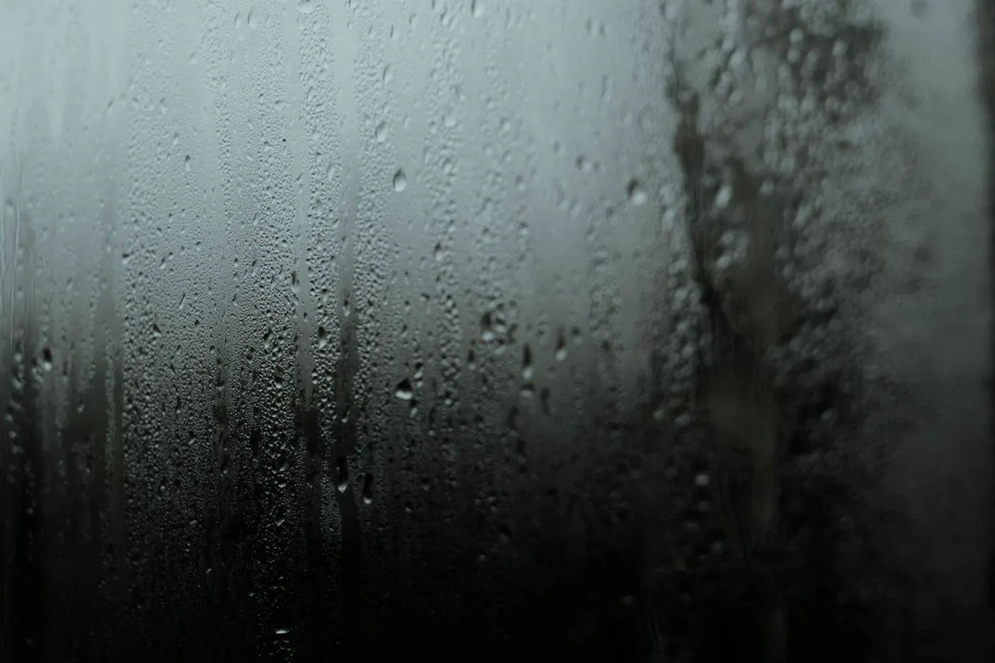 Heavy condensation droplets on skylight glass on a cold morning
